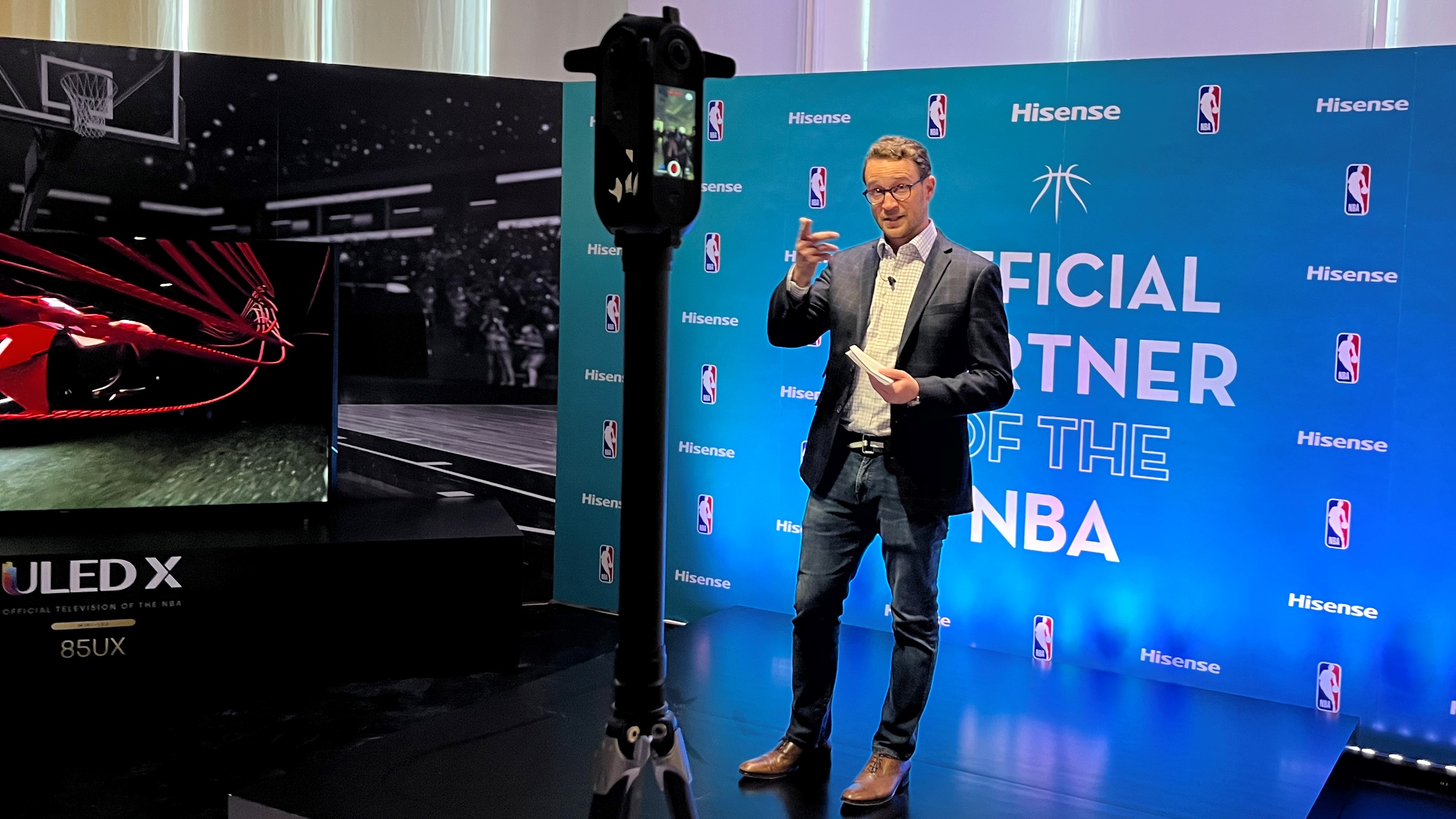 Hisense USA CEO David Gold announcing the brand's NBA sponsorship next to ULED X TV