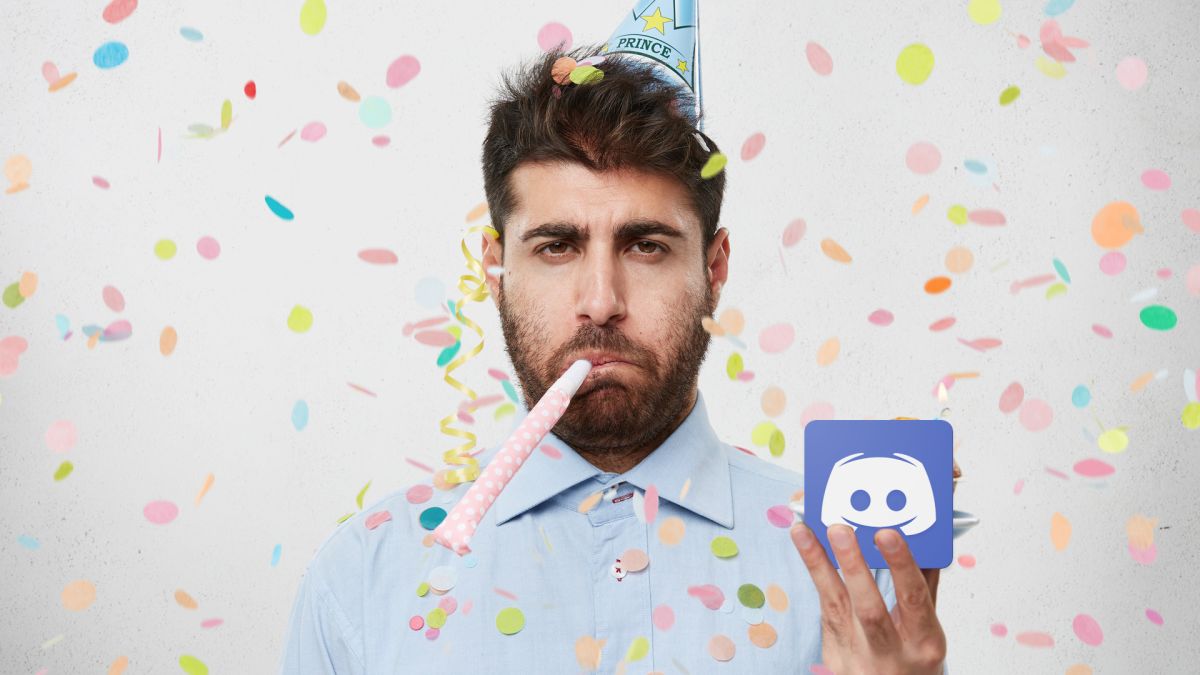 An unhappy looking man at a party holding the Discord app logo
