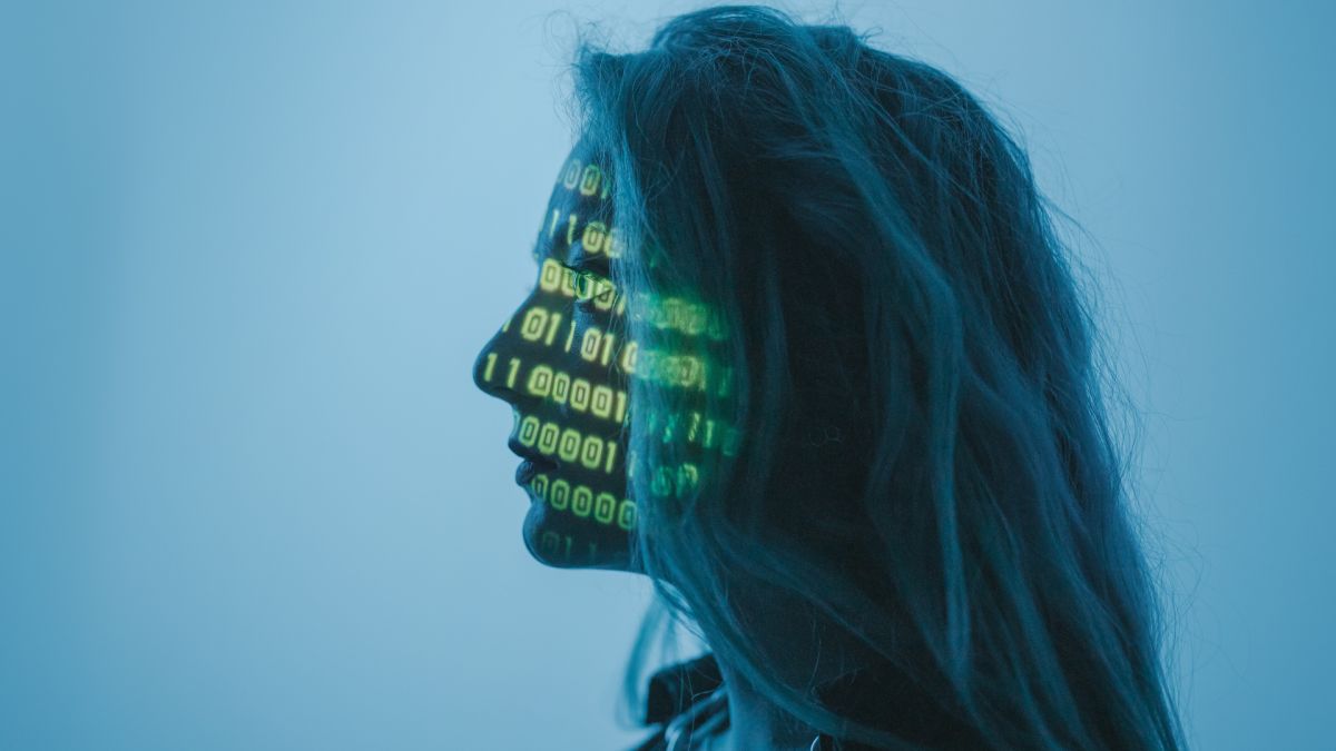 A woman with digital interface projected across her face.