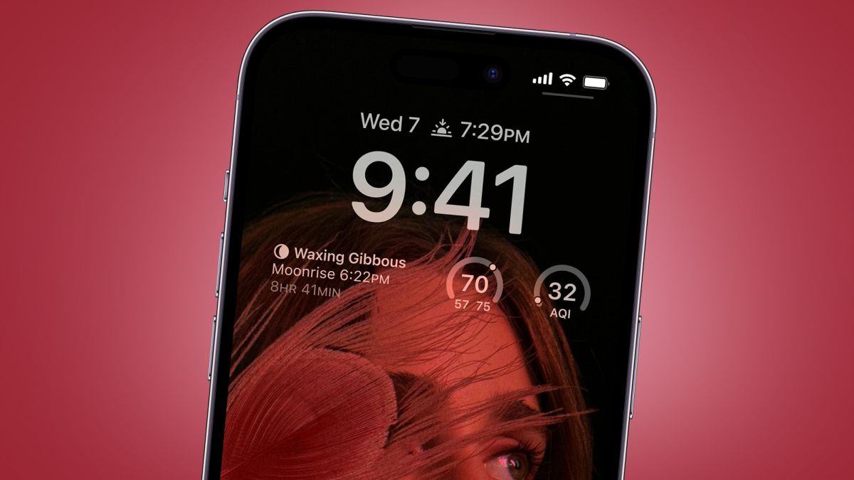 The iPhone 14 Pro on a red background