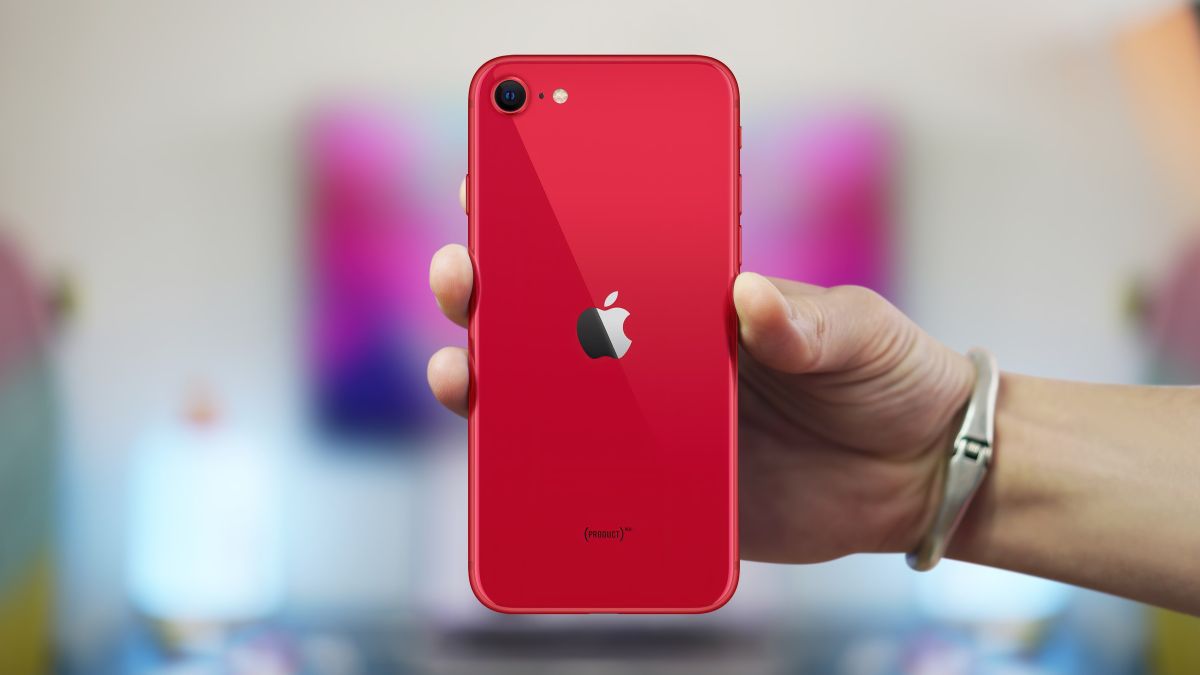 Red iPhone SE in someone