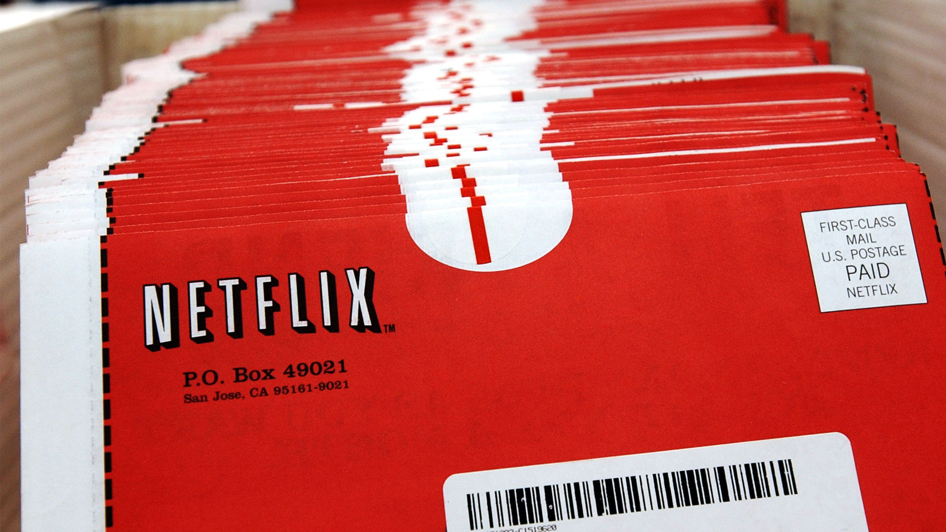 A screenshot of multiple red Netflix DVD envelopes stacked together