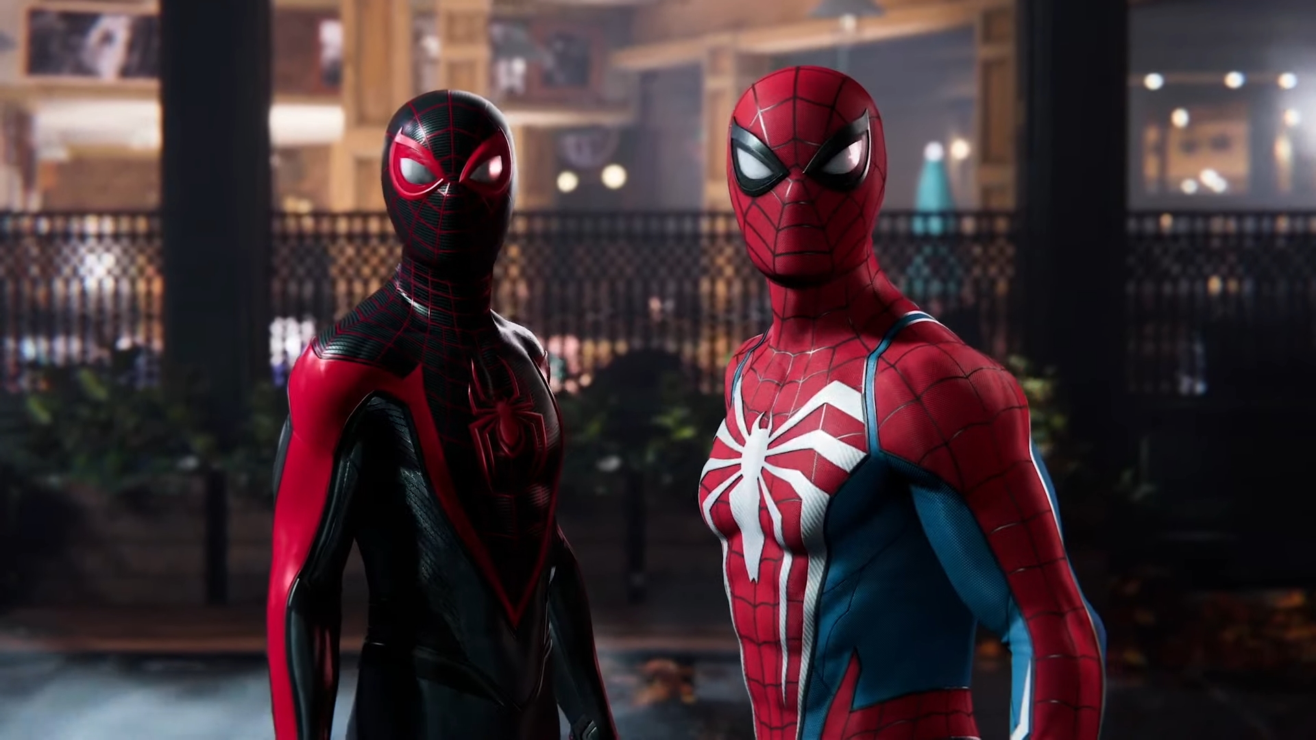 Marvel's Spider-Man 2 screenshot showing Peter Parker and Miles Morales standing side-by-side in their respective Spider-Man suits