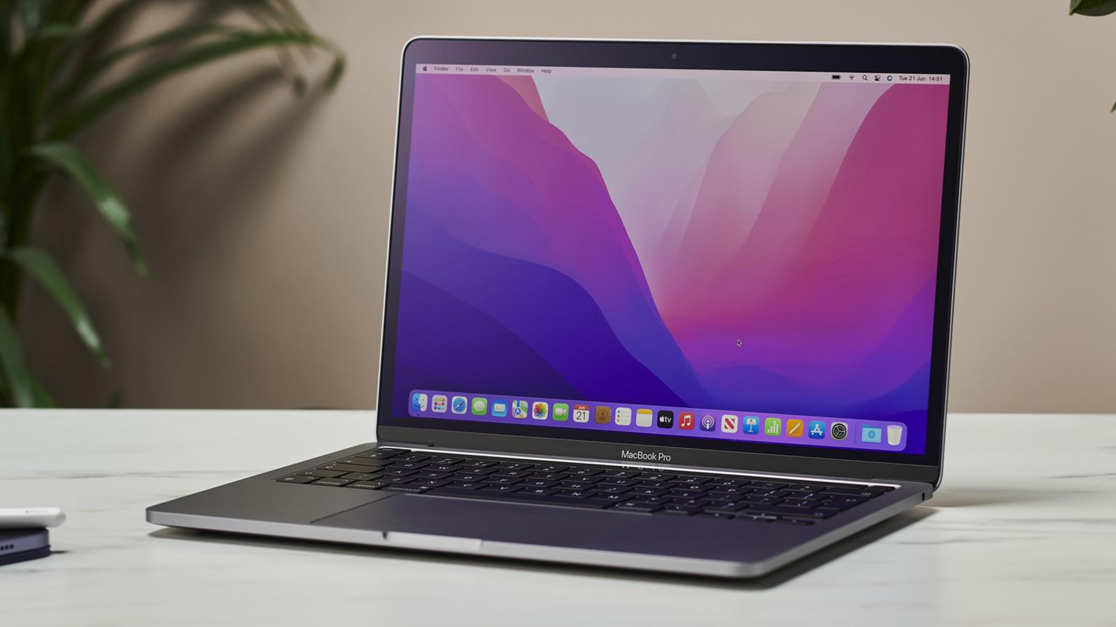 The 13-inch MacBook Pro 2022 open and facing forwards on a table