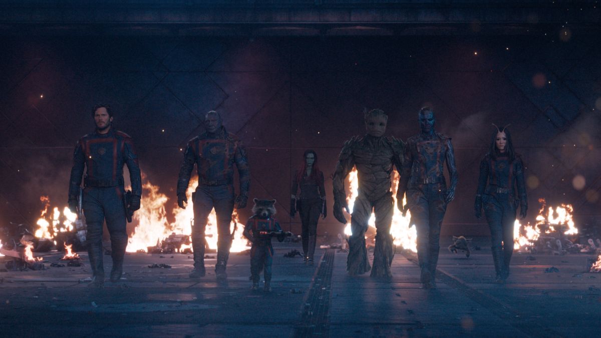 The Guardians walk towards the camera amid a scene of destruction in Guardians of the Galaxy 3