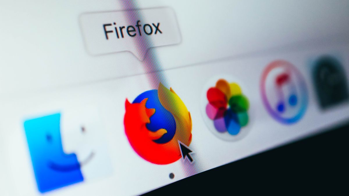 Firefox logo on a macOS taskbar next to photos and Apple music