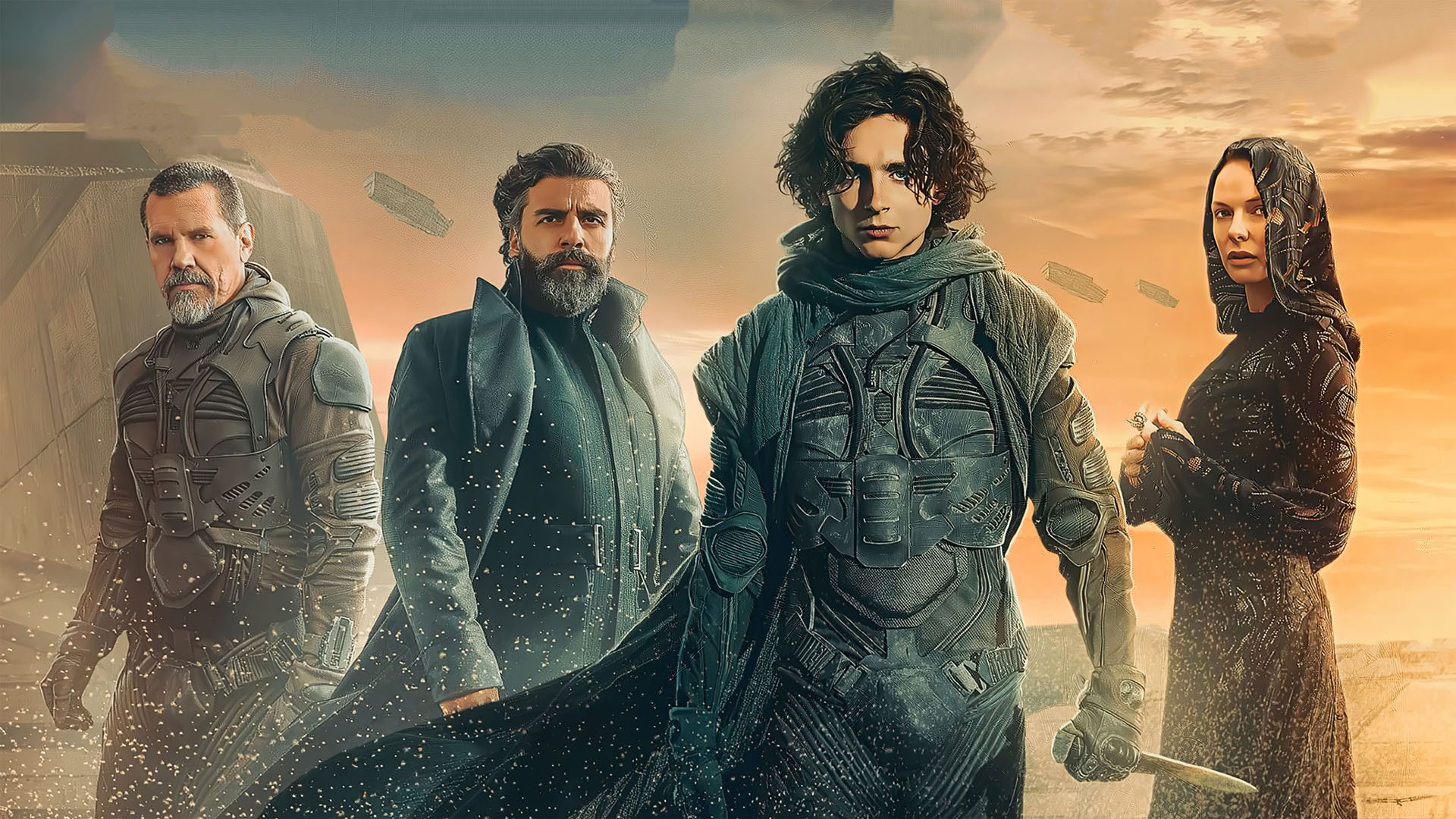 Dune cast stand in the desert for a promotional image