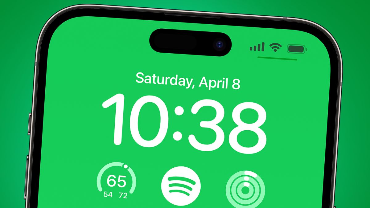 An iPhone on a green background showing Spotify