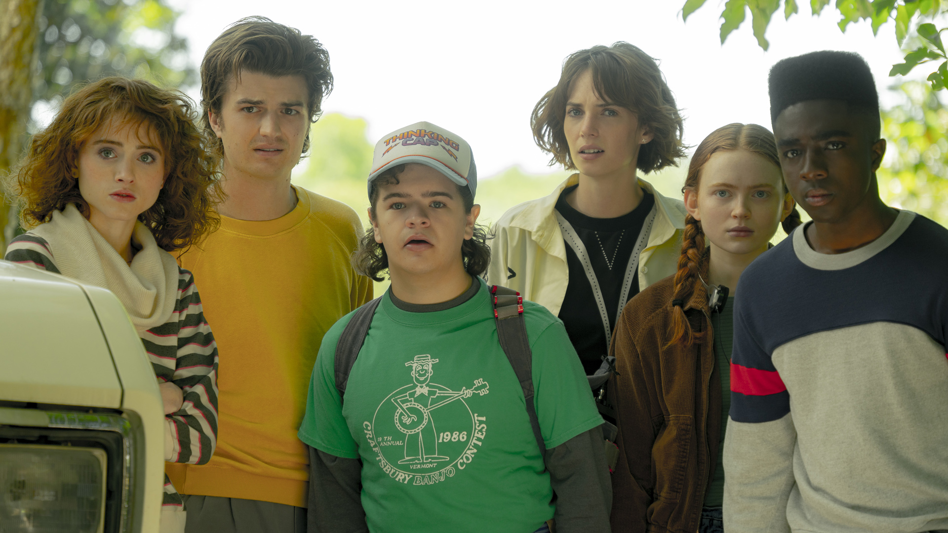 A group of some of Stranger Things' main cast stare at something off screen in season 4 volume 1
