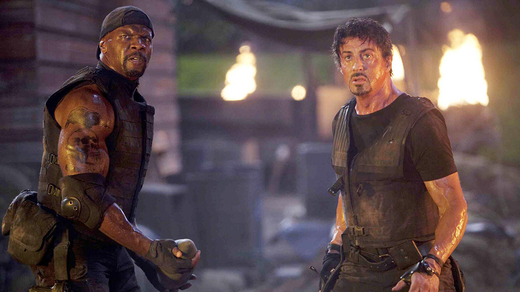 A screenshot of Terry Crews and Sylvester Stallone from The Expendables