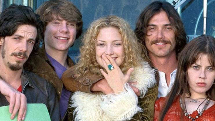 Group of teens stand together in the movie Almost Famous