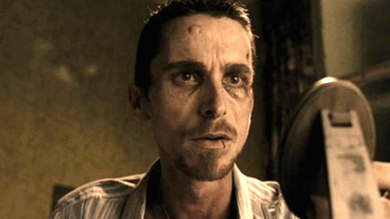 A still of Christian Bale in the movie The Machinist looking scared.