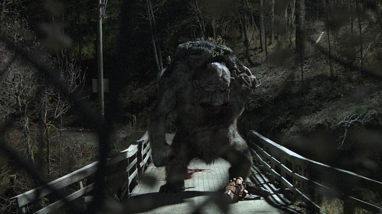 Trollhunter movie still, showing a troll on a bridge